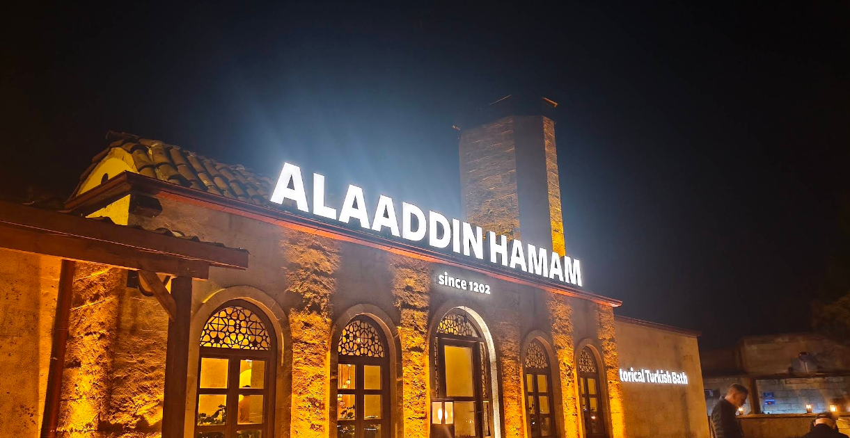 The illuminated stone exterior of Alaaddin Hamam in Avanos