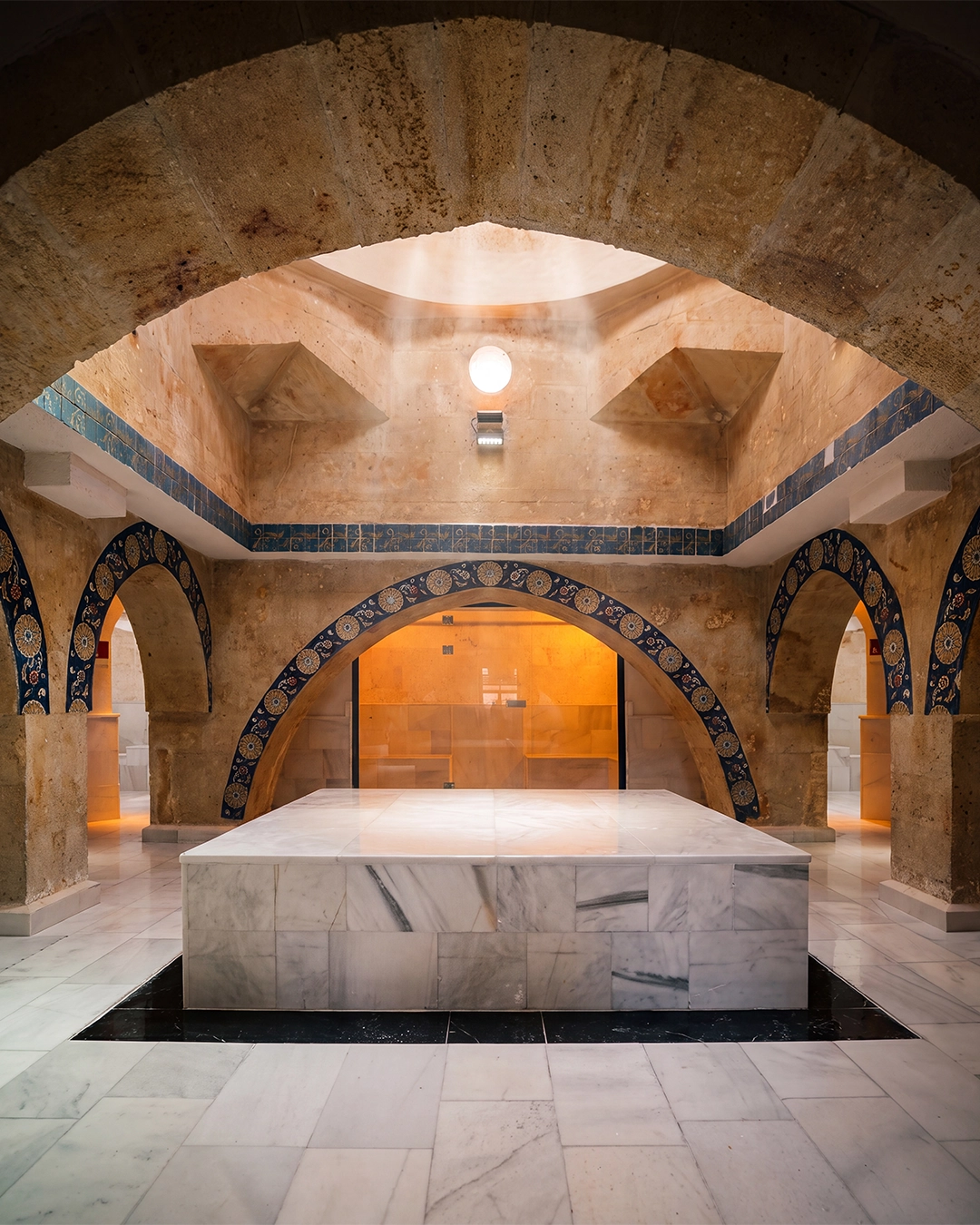 Decorated stone arches inside the historic Turkish bath