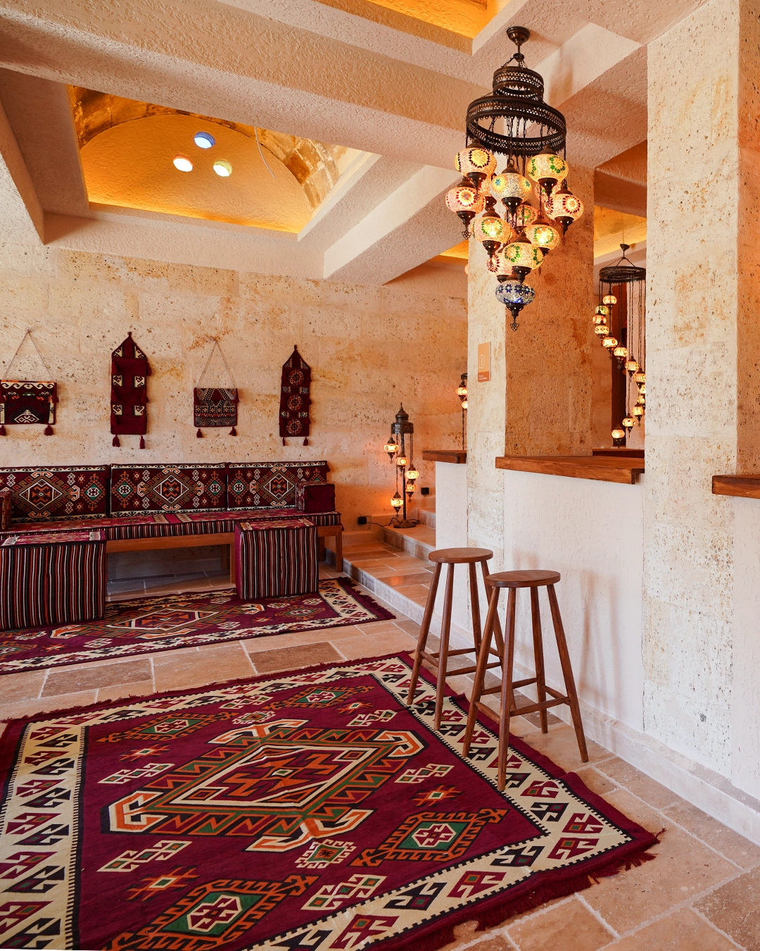 Traditional mosaic lamps illuminating the stone staircase