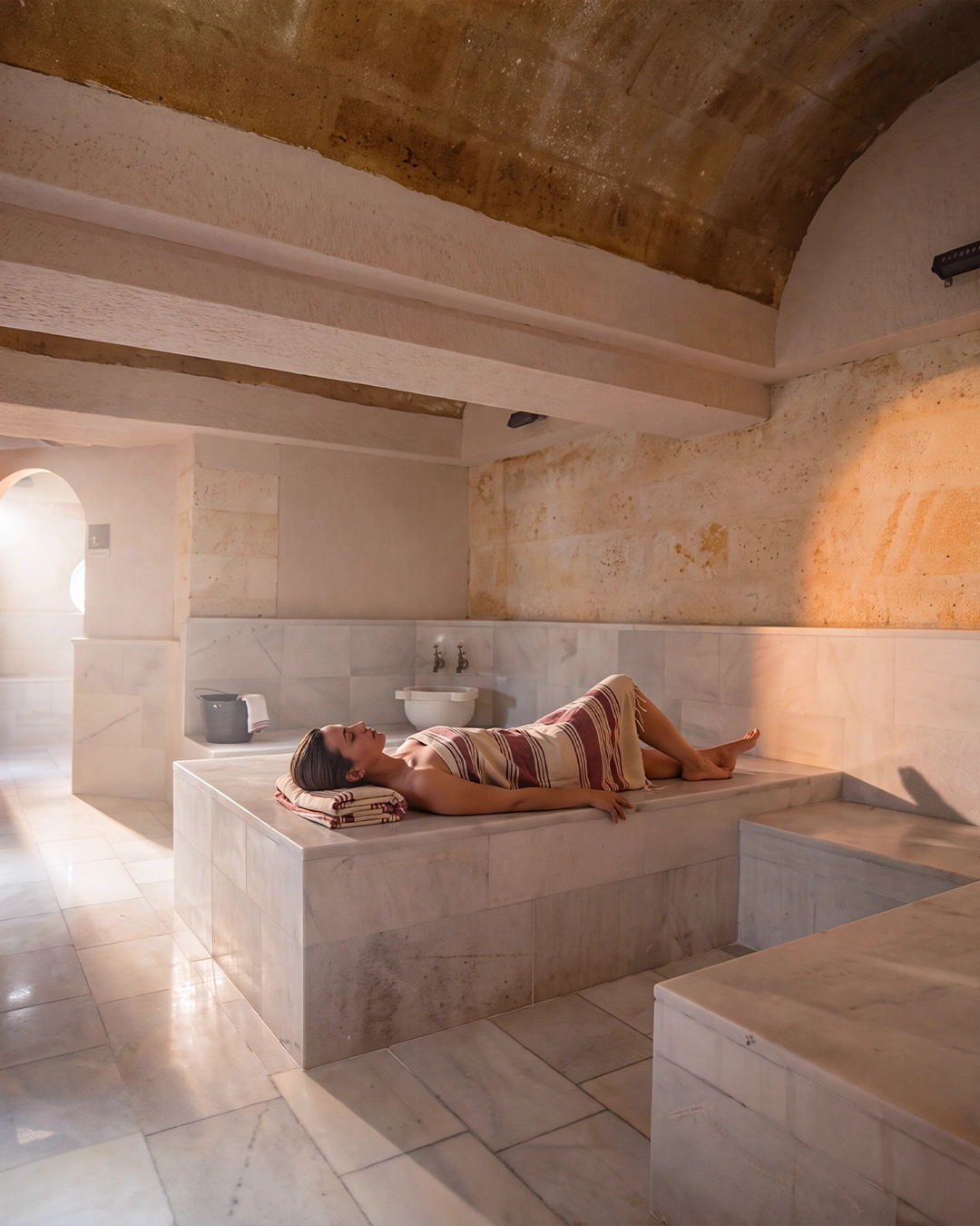 Quiet rest on warm marble before the ritual